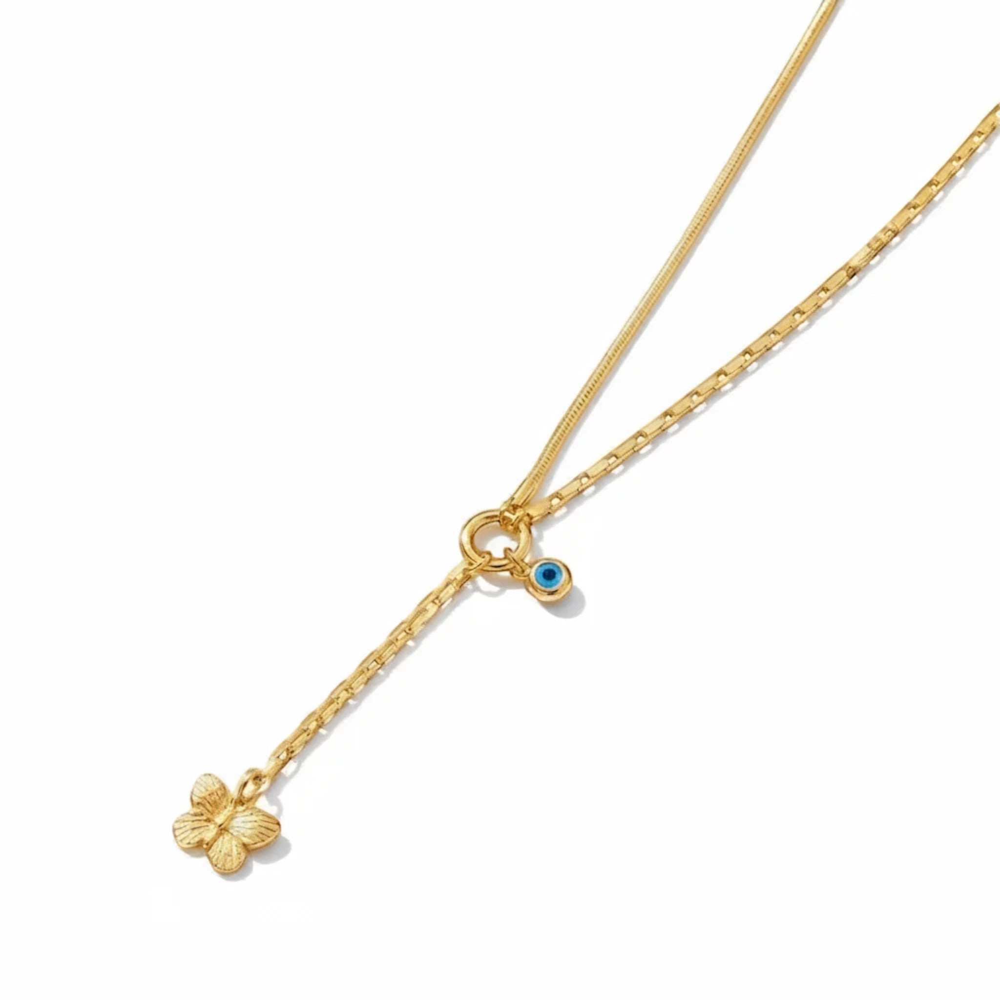 MiRA dubbelt halsband i guldtonat rostfritt stål med fjärilshänge och en liten blå evil eye-detalj.