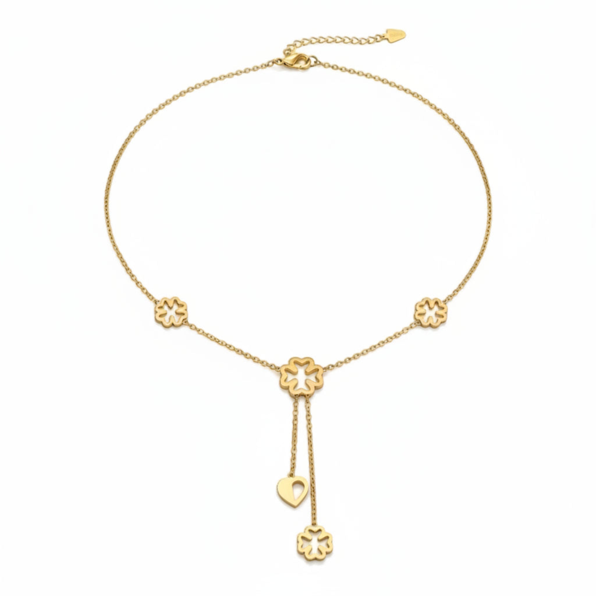 MiRA halsband i guldfärgad metall med blomformade berlocker och ett litet hjärta på en justerbar kedja.