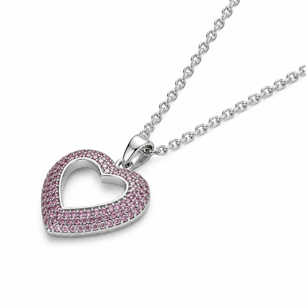 MiRA hjärtformat halsband i silver med gnistrande rosa stenar och matchande kedja för en elegant feminin look.