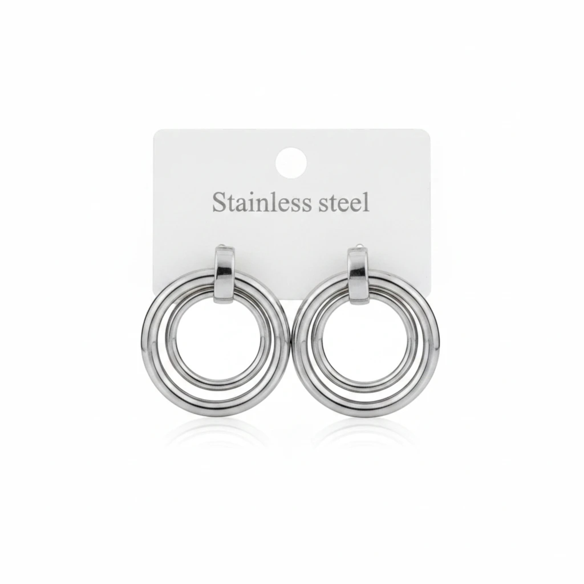 MiRA runda örhängen i silverfärgat rostfritt stål med minimalistisk design och dubbla ringar.