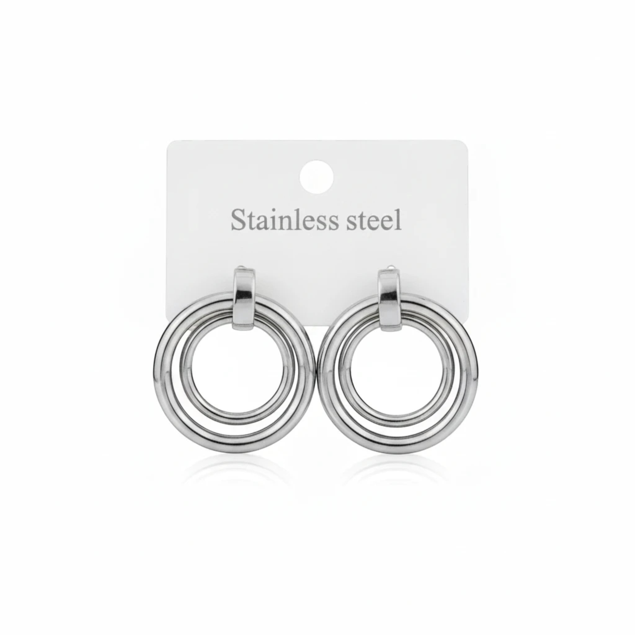 MiRA runda örhängen i silverfärgat rostfritt stål med minimalistisk design och dubbla ringdetaljer.